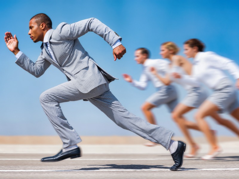 Executive Man Male running sprinting in front of runners